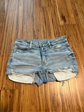 American Eagle Outfitters Light Blue Distressed Denim Shorts with Lace Pockets